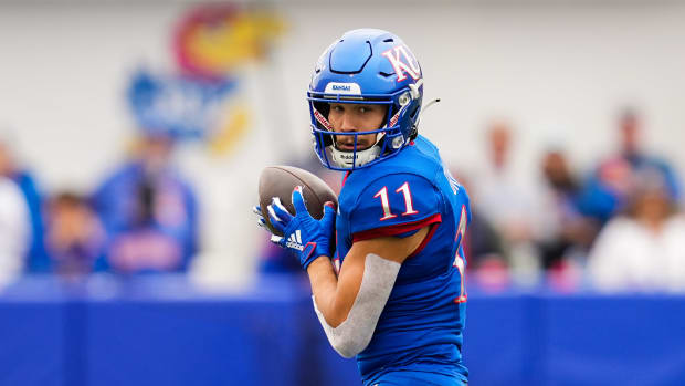Oct 23, 2021; Lawrence, Kansas, USA; Kansas Jayhawks wide receiver Luke Grimm (11) catches a pass against the Oklahoma Sooners during the second half at David Booth Kansas Memorial Stadium. Mandatory Credit: Jay Biggerstaff-USA TODAY Sports